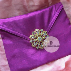 Crystal brooch embellished silk wedding envelope
